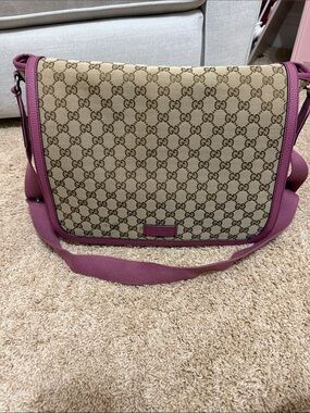 Gucci Beige Monogram Crossbody Diaper bag with Pink Trim.
